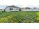 Large grassy backyard with home view at 816 William Way, Haines City, FL 33844