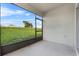 Spacious screened patio with view of grassy backyard at 816 William Way, Haines City, FL 33844