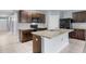 Modern kitchen with dark brown cabinets, granite counters and island at 816 William Way, Haines City, FL 33844