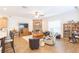 Bright living room featuring a stone fireplace and hardwood floors at 1380 E Lake Shore Blvd, Kissimmee, FL 34744
