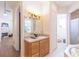 Bathroom with vanity, shower, and access to a toilet at 1380 E Lake Shore Blvd, Kissimmee, FL 34744