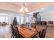 Elegant dining room with spiral staircase and hardwood floors at 1380 E Lake Shore Blvd, Kissimmee, FL 34744