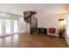 Basement with spiral staircase, wood floors, and comfortable seating at 1380 E Lake Shore Blvd, Kissimmee, FL 34744