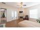 Spacious bedroom with fireplace, hardwood floors and access to patio at 1380 E Lake Shore Blvd, Kissimmee, FL 34744