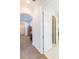 Long hallway with hardwood floors and access to other rooms at 1380 E Lake Shore Blvd, Kissimmee, FL 34744