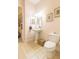 Powder room with pedestal sink and toilet at 1380 E Lake Shore Blvd, Kissimmee, FL 34744