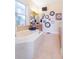 Elegant bathroom featuring a garden tub and multiple clocks at 1380 E Lake Shore Blvd, Kissimmee, FL 34744