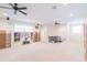 Bright bonus room featuring neutral walls, carpet flooring, and multiple ceiling fans at 1380 E Lake Shore Blvd, Kissimmee, FL 34744