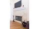 Fireplace with stone surround and hardwood floors at 1380 E Lake Shore Blvd, Kissimmee, FL 34744