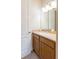 Bathroom with wood cabinets and an oval sink at 1380 E Lake Shore Blvd, Kissimmee, FL 34744