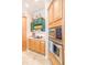 Kitchen with green cabinets and stainless steel appliances at 1380 E Lake Shore Blvd, Kissimmee, FL 34744