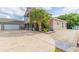 Two-story house with large driveway, palm tree, and partial view of a detached garage at 1380 E Lake Shore Blvd, Kissimmee, FL 34744