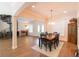 Elegant dining room with a wood table and spiral staircase at 1380 E Lake Shore Blvd, Kissimmee, FL 34744