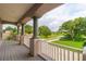 Covered balcony offering scenic views of the neighborhood and waterfront at 1380 E Lake Shore Blvd, Kissimmee, FL 34744