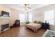 Main bedroom with fireplace, hardwood floors, and plenty of natural light at 1380 E Lake Shore Blvd, Kissimmee, FL 34744