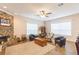 Living area with stone fireplace, hardwood floors, and comfy seating at 1380 E Lake Shore Blvd, Kissimmee, FL 34744