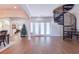 Bright entryway with hardwood floors, spiral staircase, and French doors at 1380 E Lake Shore Blvd, Kissimmee, FL 34744