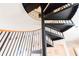 Elegant spiral staircase with black metal railings and wood accents at 1380 E Lake Shore Blvd, Kissimmee, FL 34744