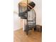 Elegant spiral staircase with metal railing and wood accents at 1380 E Lake Shore Blvd, Kissimmee, FL 34744