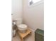 Small bathroom with toilet and pedestal sink at 1380 E Lake Shore Blvd, Kissimmee, FL 34744