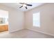 Bright bedroom with ceiling fan and window blinds at 1380 E Lake Shore Blvd, Kissimmee, FL 34744