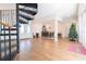 Open concept dining area with spiral staircase and hardwood floors at 1380 E Lake Shore Blvd, Kissimmee, FL 34744