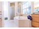 Bathroom with soaking tub and separate shower at 1380 E Lake Shore Blvd, Kissimmee, FL 34744