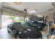 Well-lit garage with a car lift and ample space for vehicles at 1380 E Lake Shore Blvd, Kissimmee, FL 34744