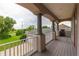 Spacious balcony with tranquil views of the backyard and surrounding landscape at 1380 E Lake Shore Blvd, Kissimmee, FL 34744