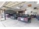 Spacious garage with car lift, workbench, and plenty of storage at 1380 E Lake Shore Blvd, Kissimmee, FL 34744