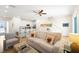 Open concept living room showcasing kitchen, dining, and seating areas at 2980 On The Rocks Pt, Kissimmee, FL 34747