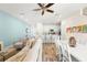 Open-concept living area with kitchen and dining space, ideal for entertaining at 2980 On The Rocks Pt, Kissimmee, FL 34747