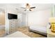Bedroom with twin bed, dresser, and ensuite bath at 2980 On The Rocks Pt, Kissimmee, FL 34747