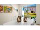Dining area with view of backyard through sliding glass doors at 2980 On The Rocks Pt, Kissimmee, FL 34747