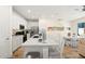 Modern kitchen featuring white cabinetry, a large island, and stainless steel appliances at 2980 On The Rocks Pt, Kissimmee, FL 34747