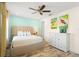 King bedroom with ceiling fan and dresser at 2980 On The Rocks Pt, Kissimmee, FL 34747