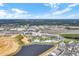 Aerial view of resort community with pools, shops, and residential buildings at 2980 On The Rocks Pt, Kissimmee, FL 34747