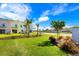 Landscaped community with colorful homes and lush greenery at 2980 On The Rocks Pt, Kissimmee, FL 34747