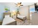 Twin bedroom with two beds and ceiling fan at 2980 On The Rocks Pt, Kissimmee, FL 34747