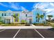 Brightly colored townhouses with parking at 2980 On The Rocks Pt, Kissimmee, FL 34747