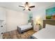 Twin bedroom with two beds and ceiling fan at 2980 On The Rocks Pt, Kissimmee, FL 34747