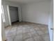 Spacious bedroom with tile floors and a closet at 2912 S Semoran Blvd # 9, Orlando, FL 32822
