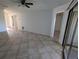 Open living room with tile floors and access to other rooms at 2912 S Semoran Blvd # 9, Orlando, FL 32822