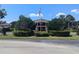Community building with landscaping and flagpole at 2912 S Semoran Blvd # 9, Orlando, FL 32822