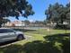 View of the community tennis court with a car parked nearby at 2912 S Semoran Blvd # 9, Orlando, FL 32822