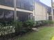 Condo building exterior view, showing landscaping and balcony at 2912 S Semoran Blvd # 9, Orlando, FL 32822