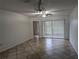 Spacious living room with tile floors and sliding glass doors at 2912 S Semoran Blvd # 9, Orlando, FL 32822