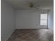 Bright living room featuring tile flooring and a ceiling fan at 2912 S Semoran Blvd # 9, Orlando, FL 32822