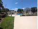 Community pool with surrounding patio and landscaping at 2912 S Semoran Blvd # 9, Orlando, FL 32822