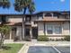 Condo building exterior with walkway and landscaping at 2912 S Semoran Blvd # 9, Orlando, FL 32822